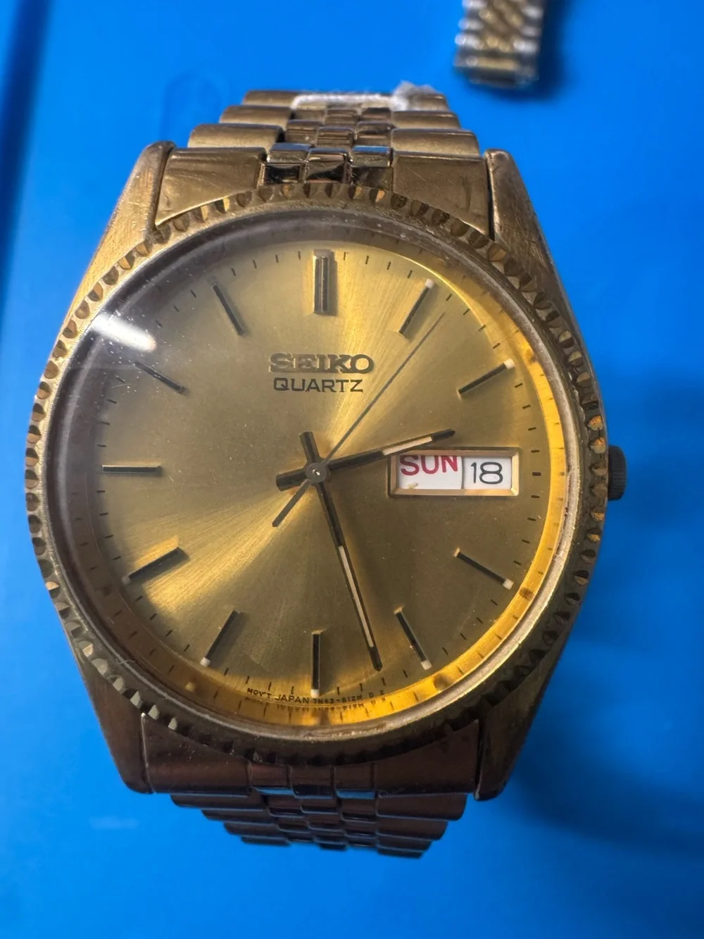 Seiko Gold Tone Sunburst Dial Watch with Day-Date